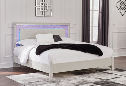 Zyniden King Upholstered Panel Bed with Mirrored Dresser and Nightstand